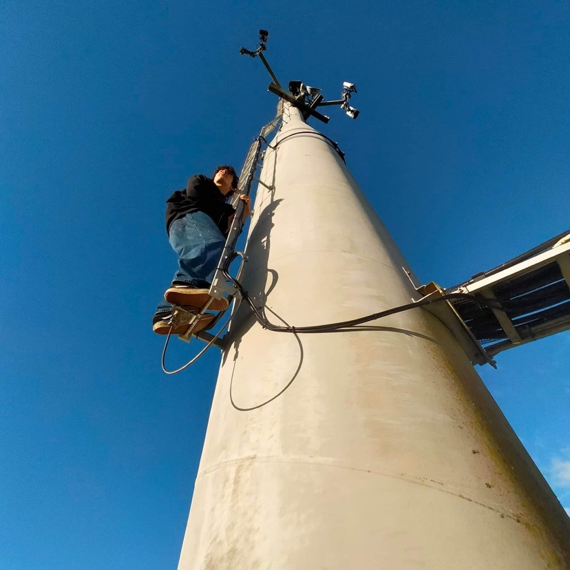 Me climbing a radio tower
